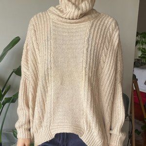 Asymmetrical vintage creme turtleneck